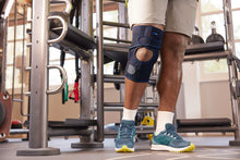 Load image into Gallery viewer, Actimove Sports Edition Knee Brace Wrap Around Polycentric Hinges Condyle Pads
